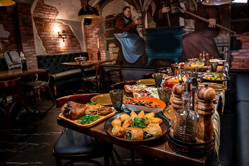 Restaurant table, many different dishes.