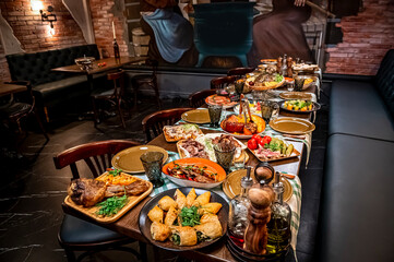 Restaurant table, many different dishes.