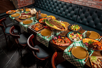 Restaurant table, many different dishes.