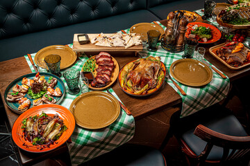 Restaurant table, many different dishes.