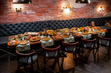 Restaurant table, many different dishes.