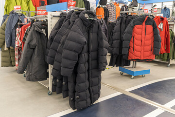 men's winter jackets on hangers in the store
