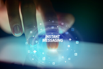 Finger touching tablet with social media icons concept