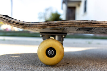 Close up of old wood skateboard