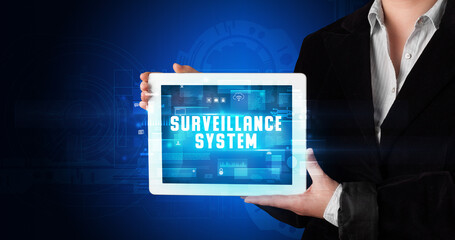 Person holding tablet, security concept