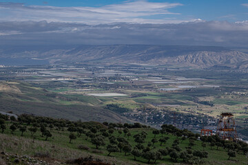 Fototapeta premium View of the Jordan Valley, Jordanian villages in the East and Israeli villages in the West, as seen from Belvoir National Park, Northern Israel, Israel