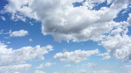 Cumulus clouds and blue sky suitable for background or sky replacement.