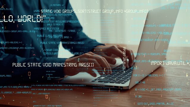 Computer programmer uses capable laptop computer to develop programming code of new software . Computer specialist working on future coding application for software programming development .