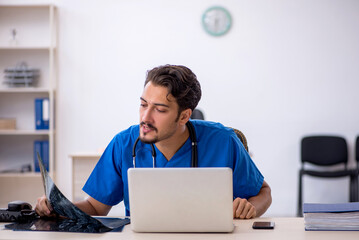 Young male doctor radiologist working in the clinic