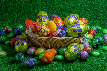Easter eggs in basket on green background. Welcome easter.