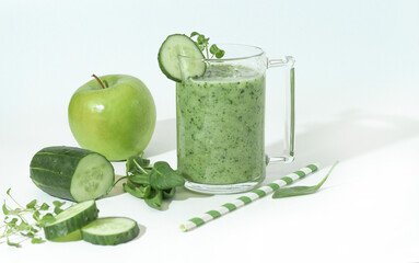 Green smoothie, cocktail with cucumber, green apple, spinach, micro-greens. Superfood,organic drinks on a white background