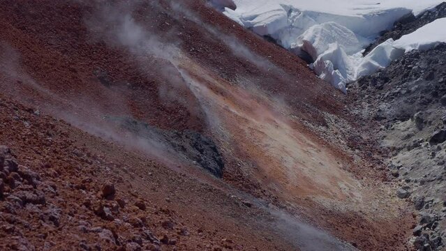Caldera of Avachinsky stratovolcano, also known as Avacha Volcano. Swinging steam from hot geysers. Kamchatka Peninsula, Russia.
