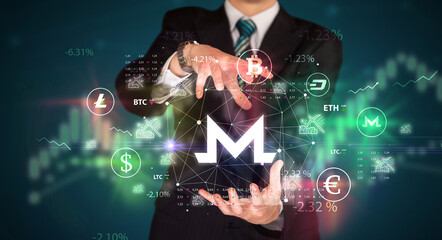 Businessman holding currency symbols concept