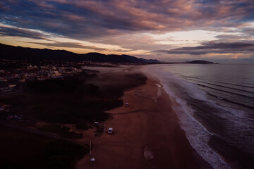 Campeche beach and ocean with sunrise or sunset in Florianopolis