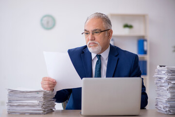 Old male employee and too much work in the office