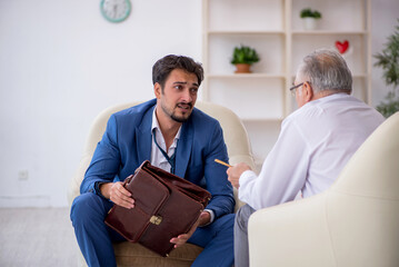 Young businessman employee visiting psychologist
