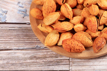 Badam, almonds is on the wooden table