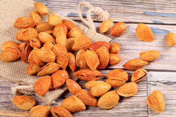 Badam, almonds is on the wooden table