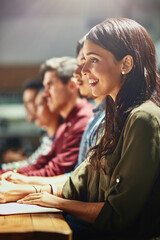 Filling their minds with creative ideas. Shot of a team of designers sitting in a meeting together.