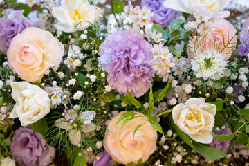 Bouquet of pink roses, baby's-breath and purple violets