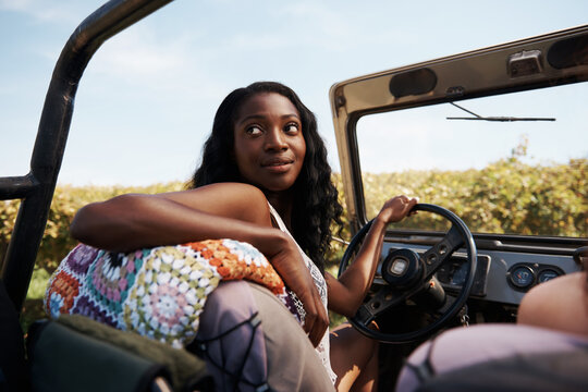 Weve Come A Long Way. Cropped Shot Of A Young Woman Driving A Car.