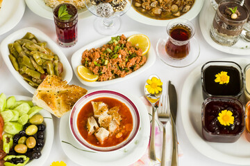 Traditional Turkish Ramadan Iftar,Dinner Table With Soup,red rose sherbet and Ramadan Bread.Beginning menu