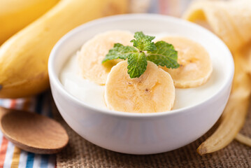 Yogurt with banana in bowl, Healthy eating