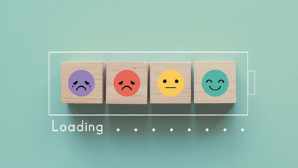 
Emotion wooden blocks in loading bar ,mental health assessment, child wellness,world mental health...