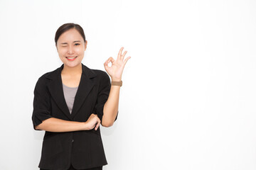 Beautiful Asian business woman wearing black suit okay sing presenting something on  white background and copy space. Confident Asian working woman smiling and cheerful