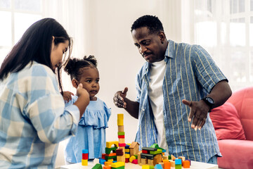 Portrait of happy love black family african american father and mother with little girl smiling...