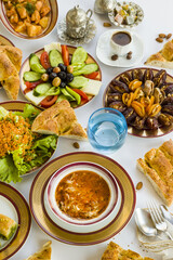 Traditional Turkish Ramadan Iftar,Dinner Table With Soup,salad  fruits and Ramadan Bread.Beginning menu