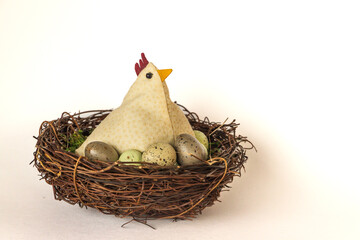 decorative chicken in a nest with eggs
