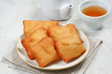 odading or beignet, indonesian fried bread on white background