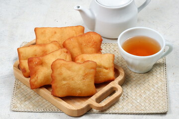 odading or beignet, indonesian fried bread on white background