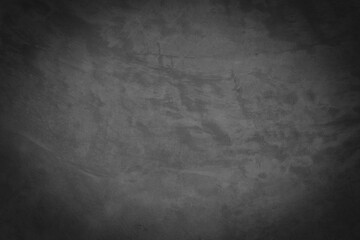 Old gray cement wall with cracks on the surface.