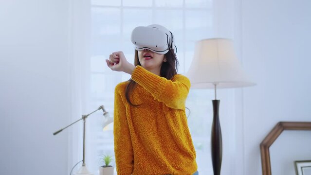 smart casual asian businesswoman attend online virtual meeting presentation new collections cloth fashion set to her worldwide client using virtual reality technology vr headset at home studio daytime
