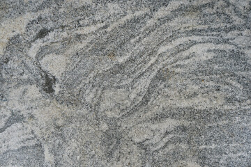 Abstract texture of gray gneiss rock background.