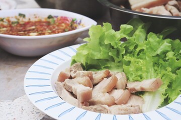 Bossam korean boiled pork wraps chili spicy sauce