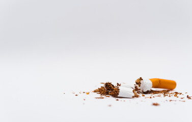 31 May of World No Tobacco Day, no smoking, close up of broken pile cigarette or tobacco STOP symbolic on white background with copy space, and Warning lung health concept