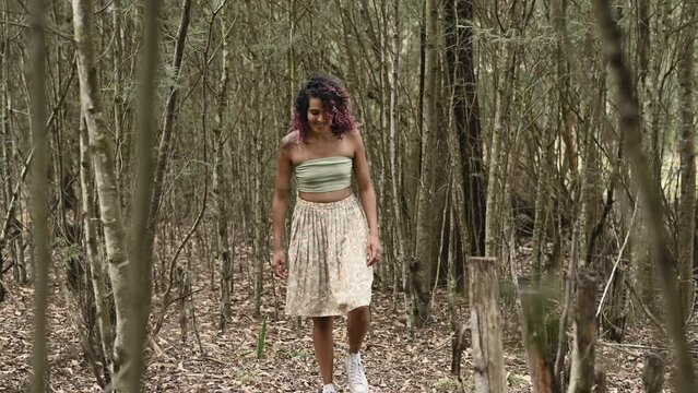 Woman seen walking in forest during fall