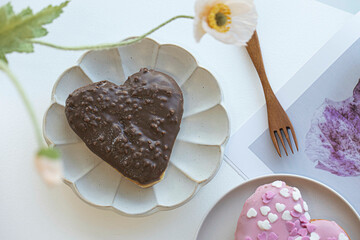 Heart shaped donut on white background