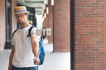 Traveling man taking photo or video with smartphone for social network upload, travel blog and vlog, post covid world traveler concept