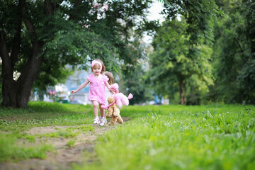 Obraz premium Mom with two daughters twins