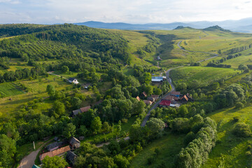 Fototapeta premium Flying over a village in Transylvania, Romania by drone