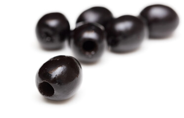 Black olives isolated on a white background.