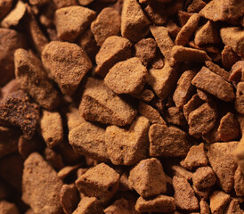 Instant coffee granules as background.