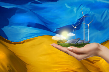 solar panels and wind turbines against flag of Ukraine