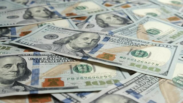 Close up American one hundred dollar banknotes wallpaper. Wealth concept, free trade, business concept.