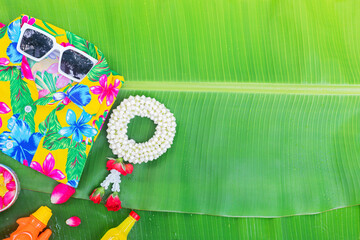 Songkran Festival background with jasmine garland Flowers in a bowl of water, perfume and limestone...