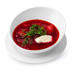 Bowl of beet root soup borsch isolated on white background